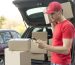 medium-shot-delivery-guy-with-phone